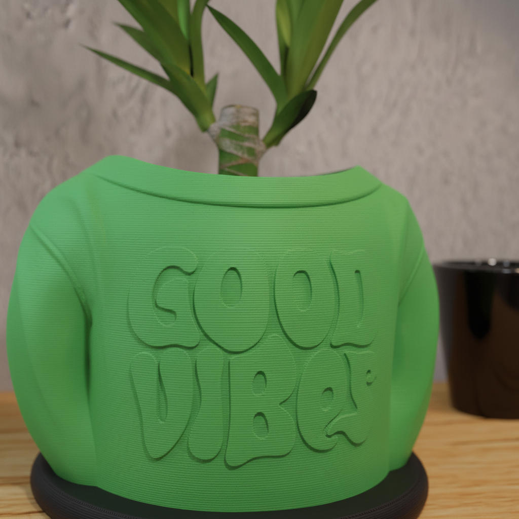 Close-up of Good Vibes embossed text on green 3D printed planter