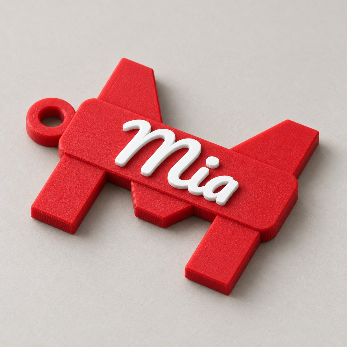 Initial and Name Banner Keychain: red 'M' / 'Mia' keychain alone at a three-quarter angle