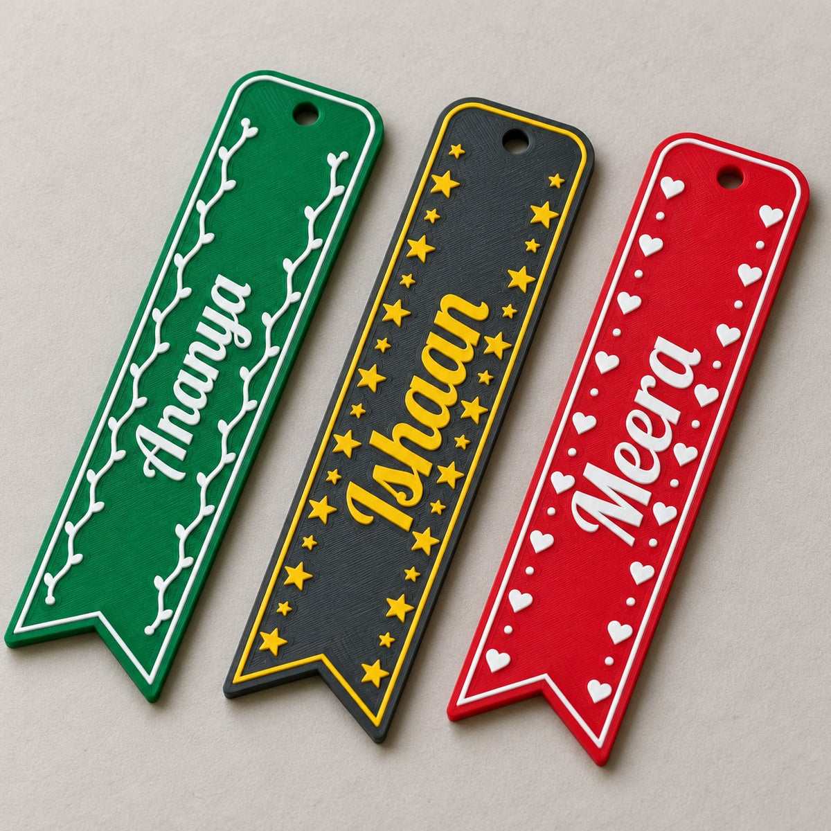 Name Bookmark: three bookmarks (Ananya, Ishaan, Meera) laid side by side, top-down at a slight angle