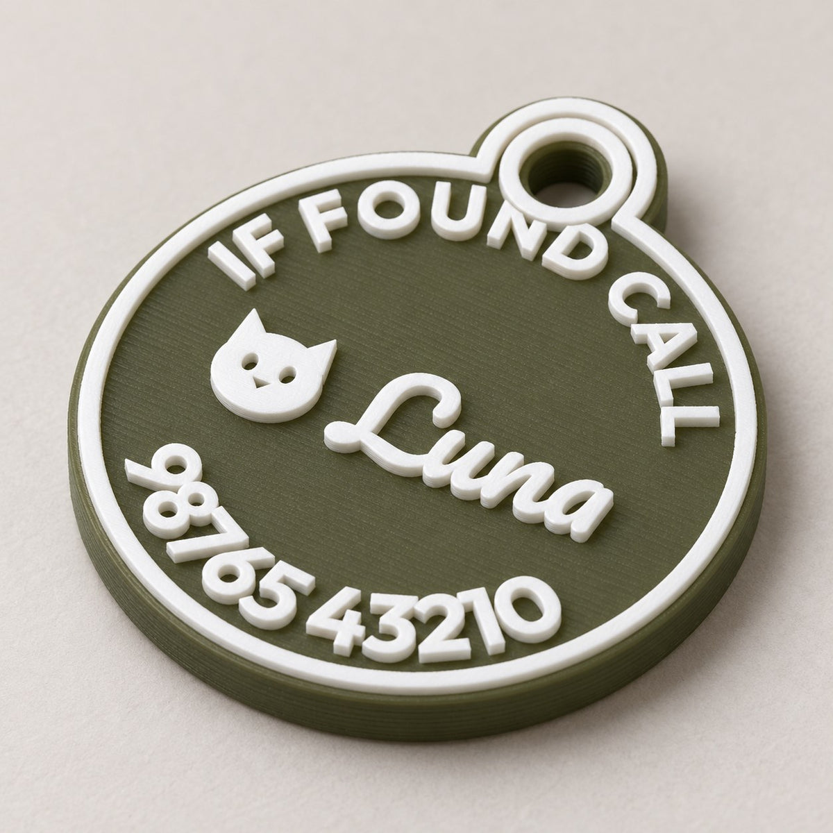 Round Pet ID Tag: green 'Luna' round tag alone at a three-quarter angle