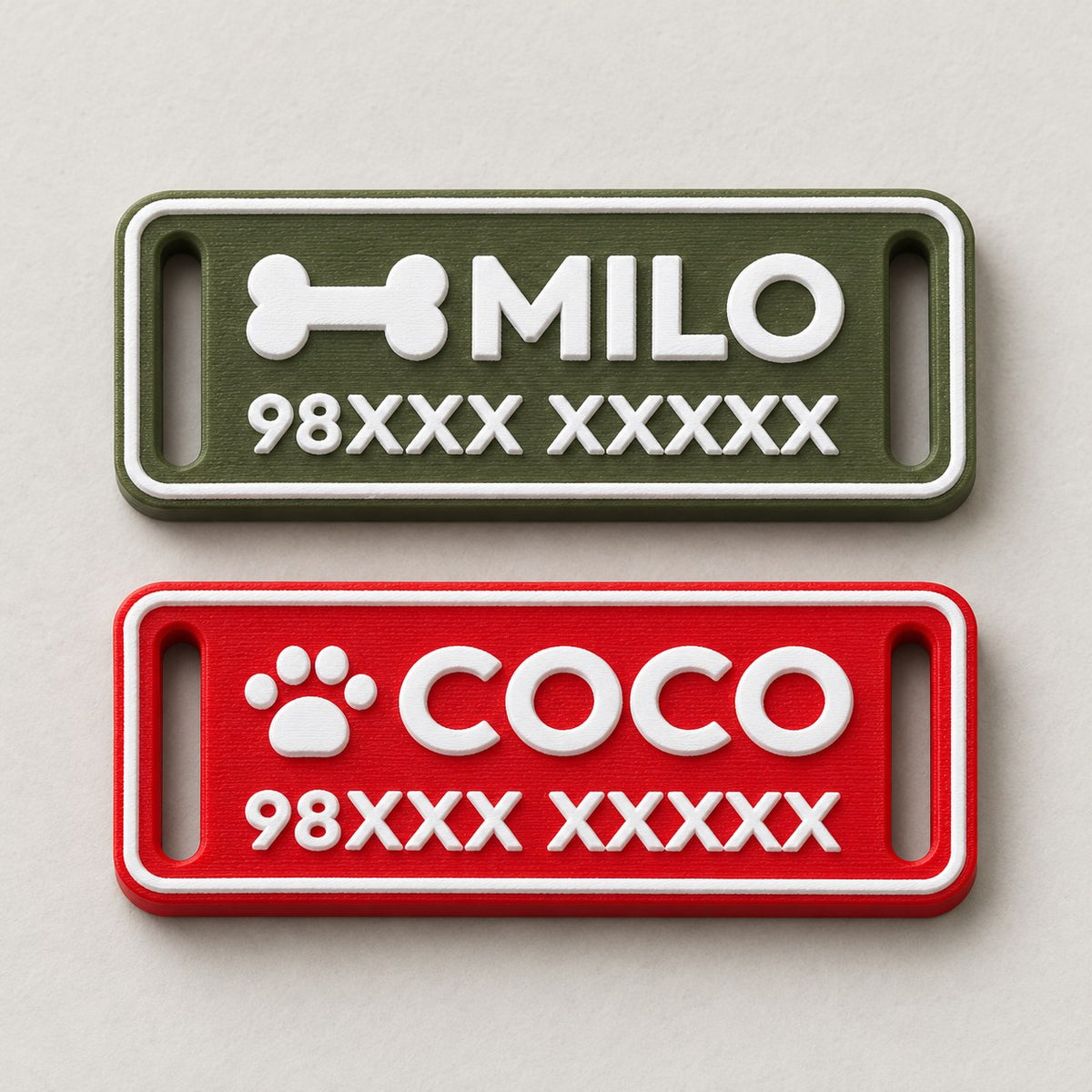 Silent Pet ID Tag: green MILO and red COCO tags lying flat side by side, top-down