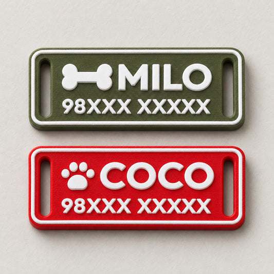 Silent Pet ID Tag: green MILO and red COCO tags lying flat side by side, top-down