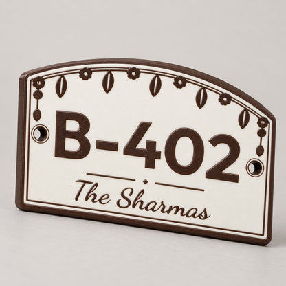 House Number Plate with Family Name: brown 'B-402 The Sharmas' plate alone, standing at a slight three-quarter angle