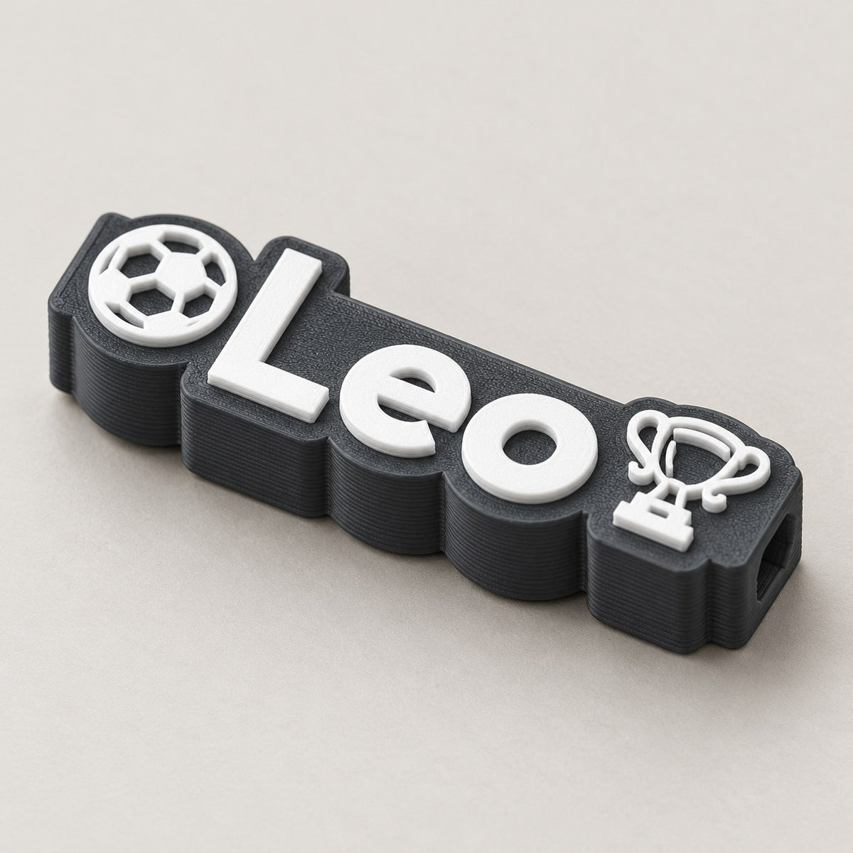 Football Name Pencil Topper: dark 'Leo' football topper alone at a three-quarter angle