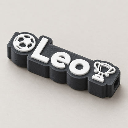 Football Name Pencil Topper: dark 'Leo' football topper alone at a three-quarter angle