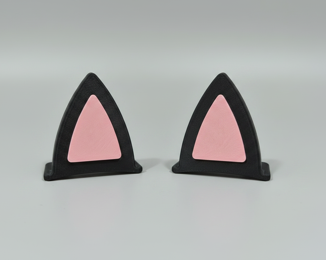 Cat ear clips - black outer shell, pink inner - light grey studio background