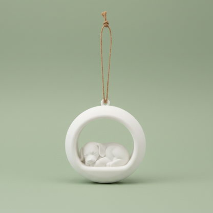 Sleeping Puppy Ornament studio shot with sage green background