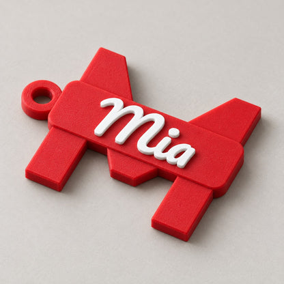 Initial and Name Banner Keychain: red 'M' / 'Mia' keychain alone at a three-quarter angle
