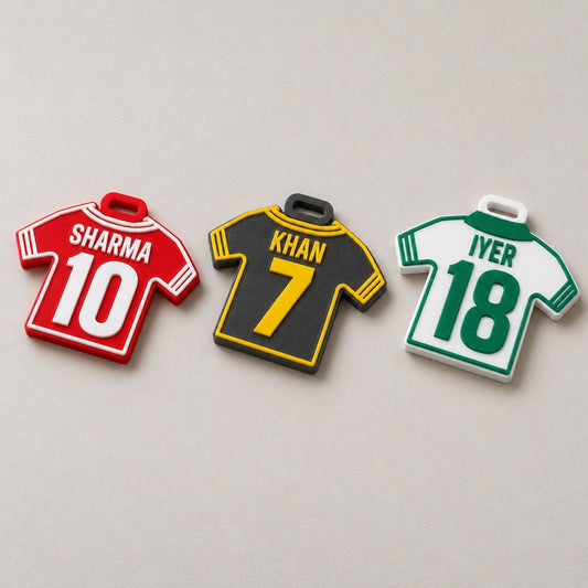 Jersey Kit Bag Tag: three tags (SHARMA 10, KHAN 7, IYER 18) laid flat in a row, top-down at a slight angle