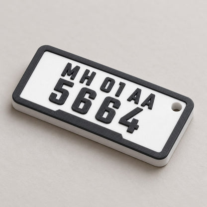 Number Plate Keychain: white 'MH 01 AA / 5664' plate keychain alone at a three-quarter angle
