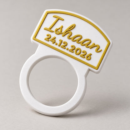 Personalised Napkin Ring: white 'Ishaan' napkin ring standing upright alone at a three-quarter angle, empty