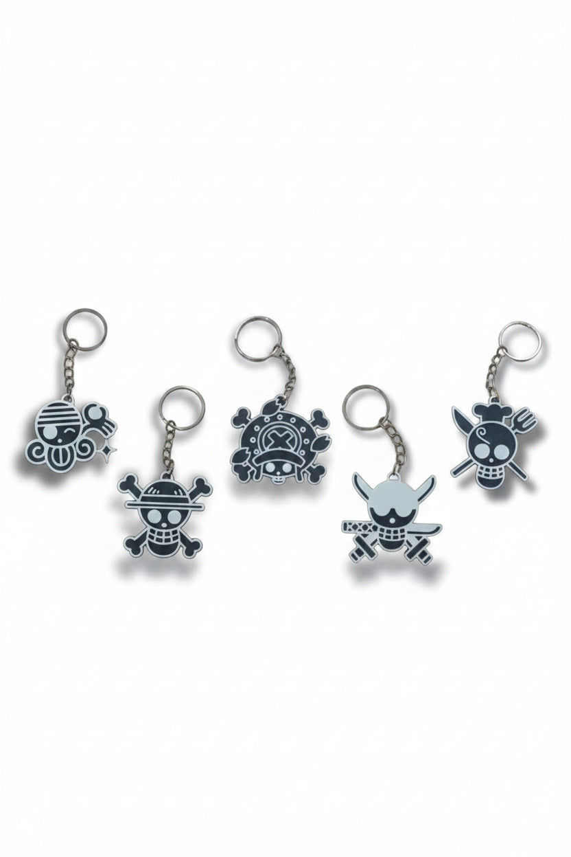 Set of five keychains with skull and crossbones designs on a white background