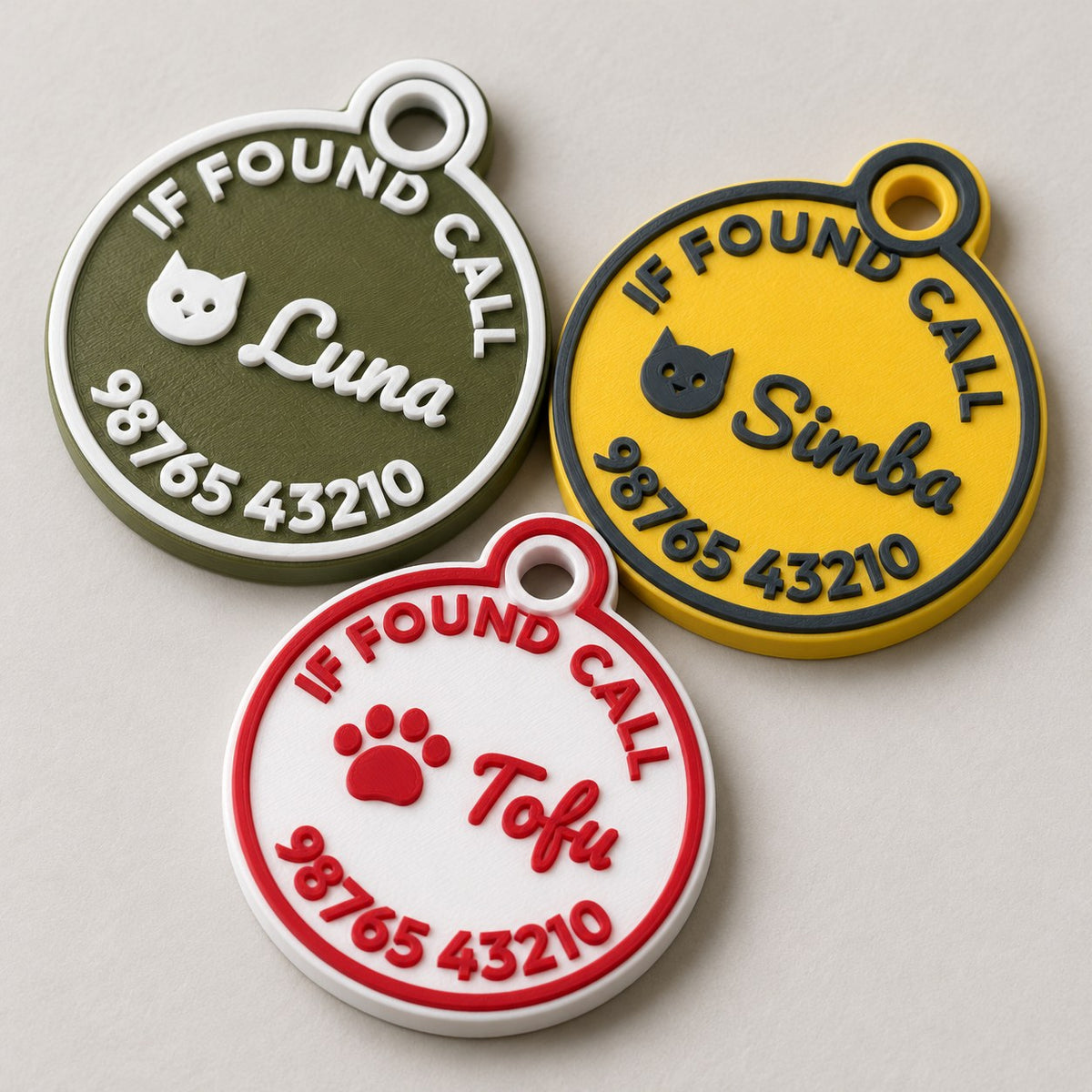 Round Pet ID Tag: three round tags (Luna, Simba, Tofu) laid flat, slightly overlapping, top-down