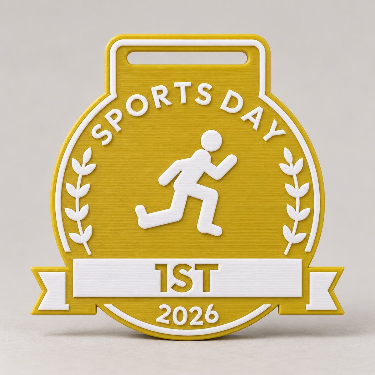 Gold-yellow 3D-printed Sports Day medal with white lettering, a runner, laurels and 1ST on a white banner