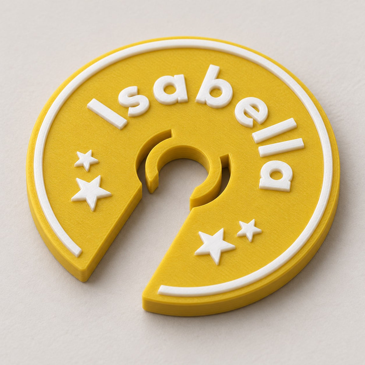 Wine Glass Name Tag: gold 'Isabella' ring alone lying flat at a three-quarter angle
